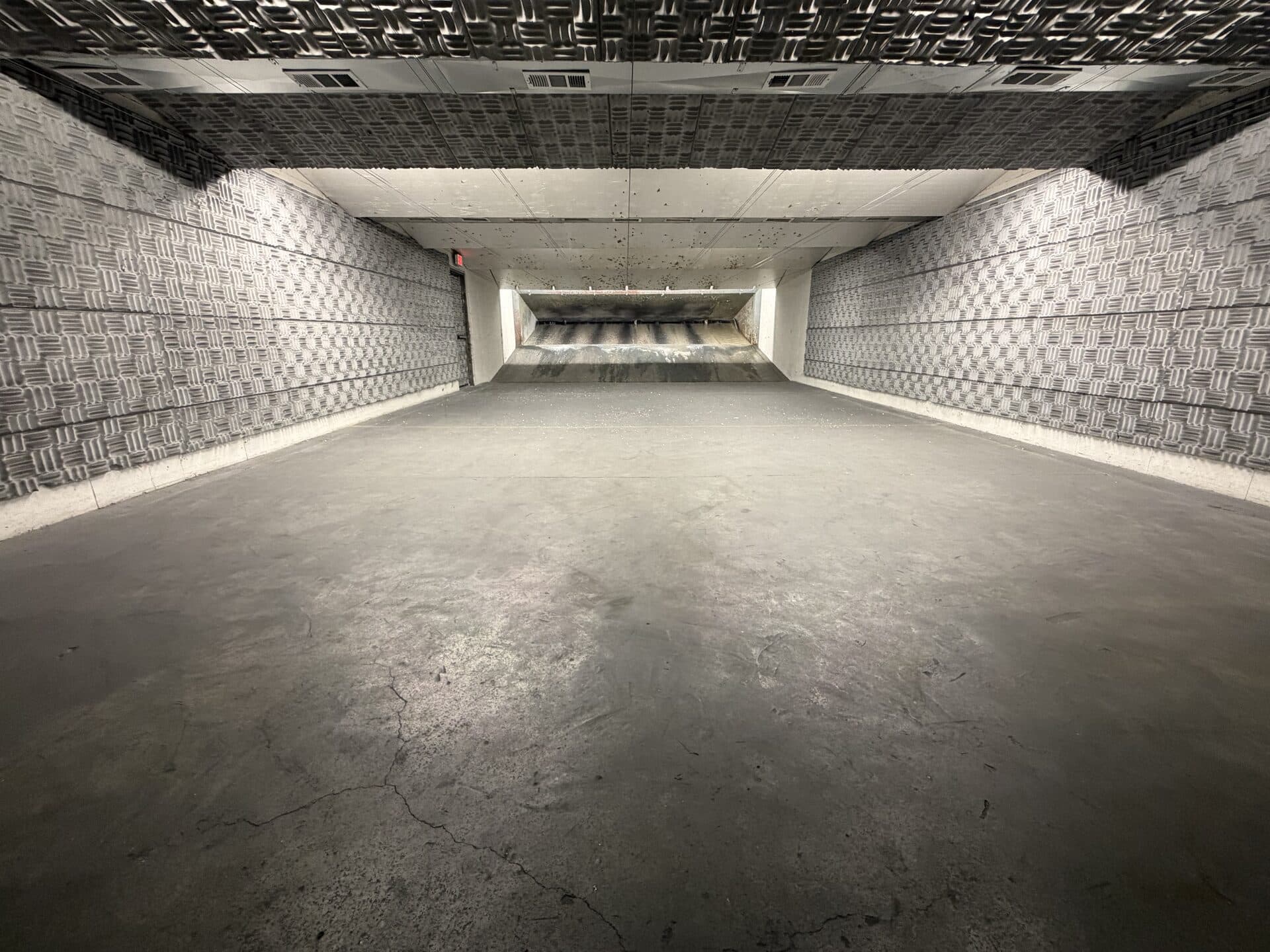 Indoor pistol range — long downrange view