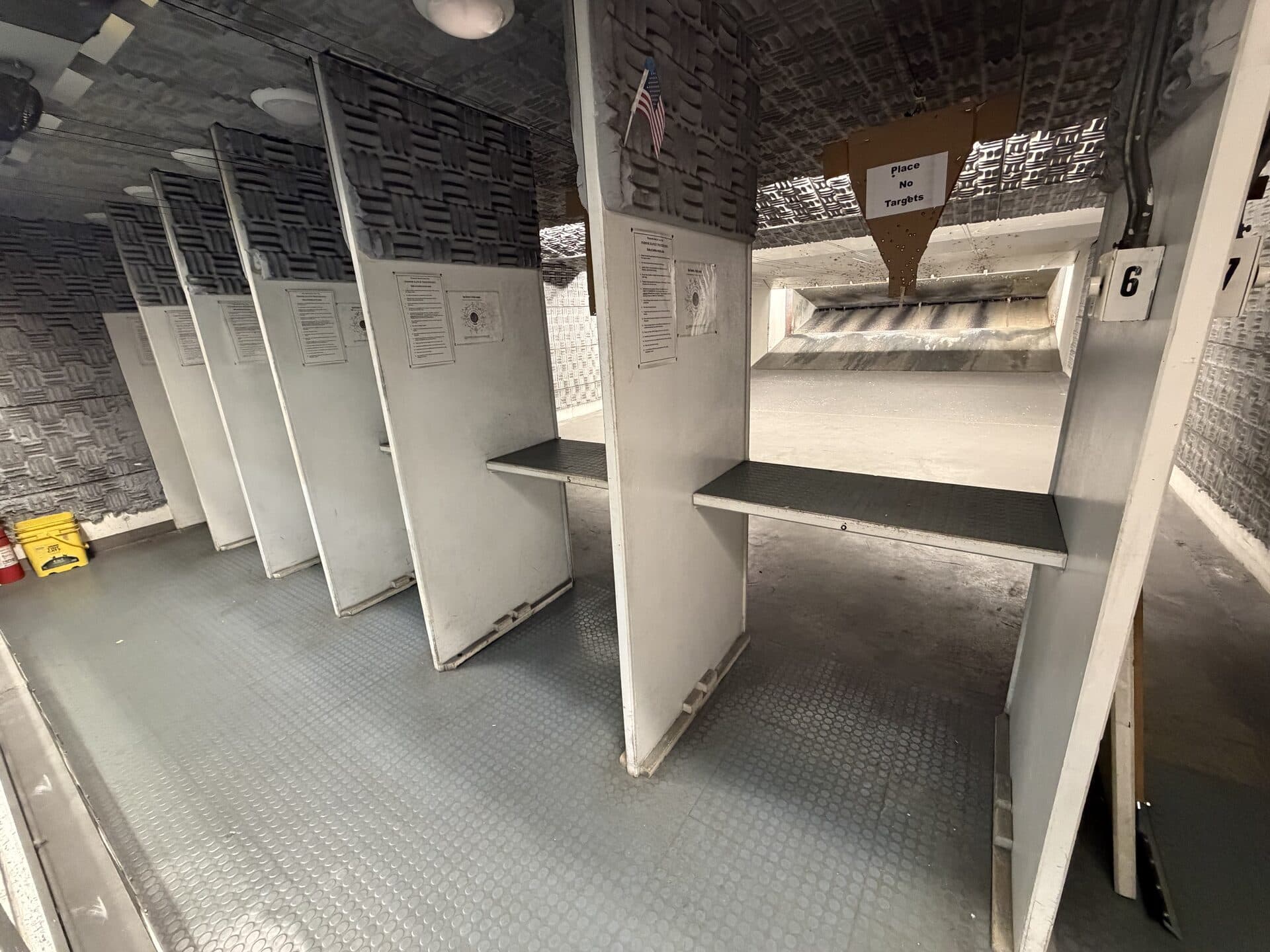 Indoor pistol range — seven numbered shooting lanes