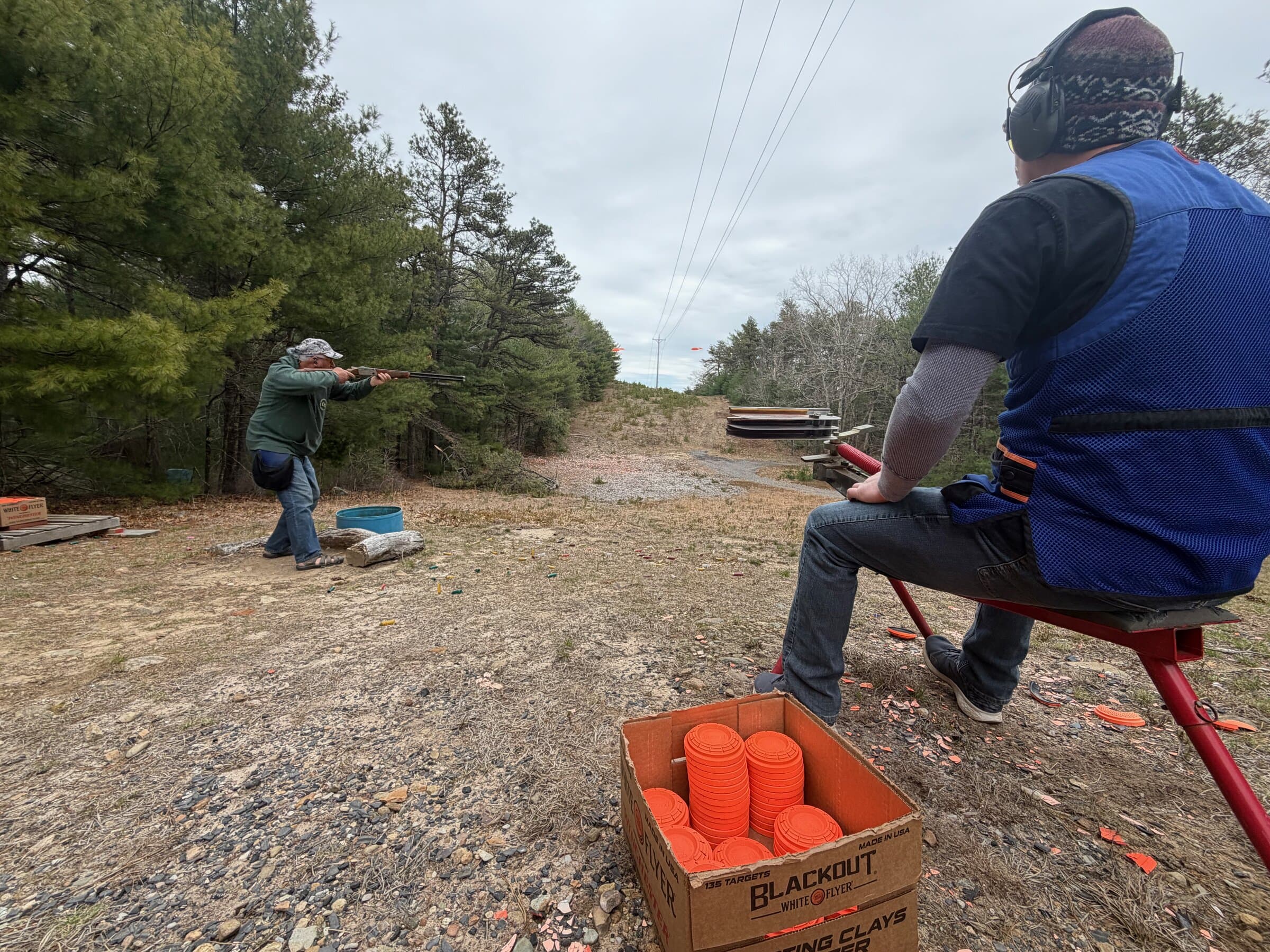 Behind-the-shooter view between stations · clays box in foreground